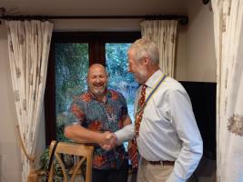 Francis Ulrych (right) is congratulated by a relieved looking outgoing president Shaun Yeoman